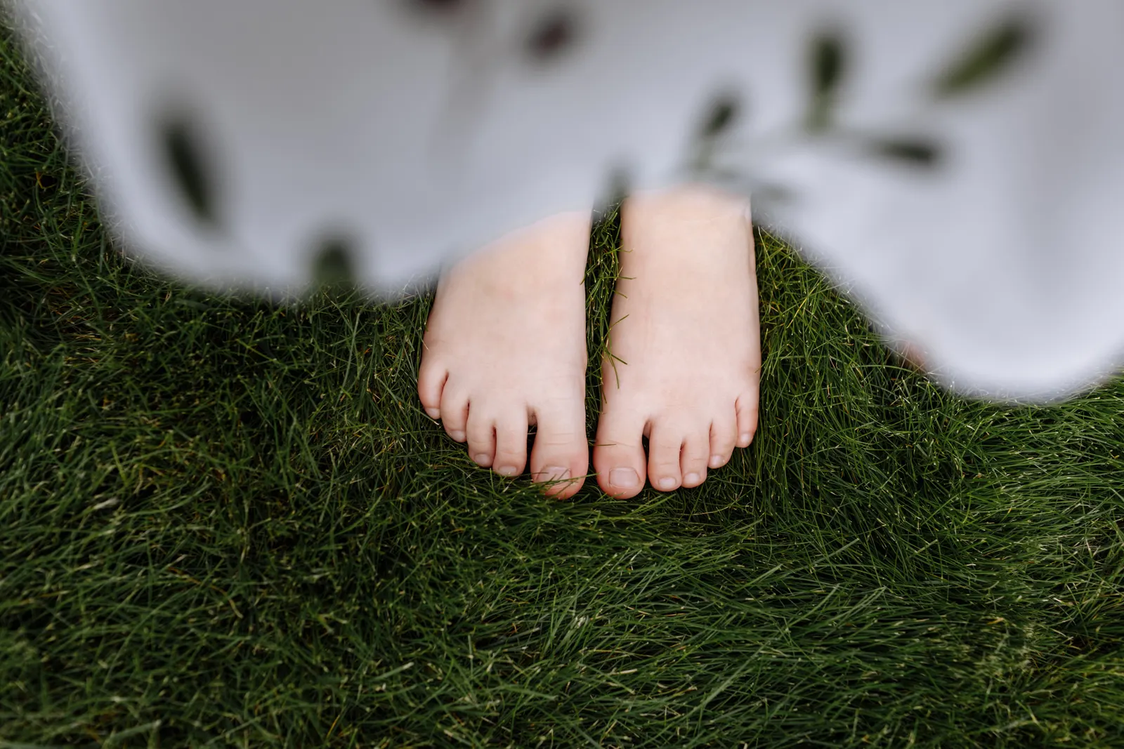 Bare feet and toenails on a clean neutral background