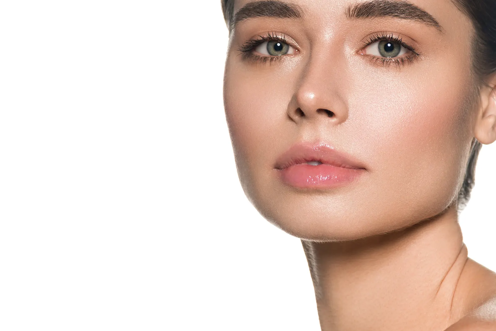 Close-up of a woman’s face showing natural skin around the lip and jaw
